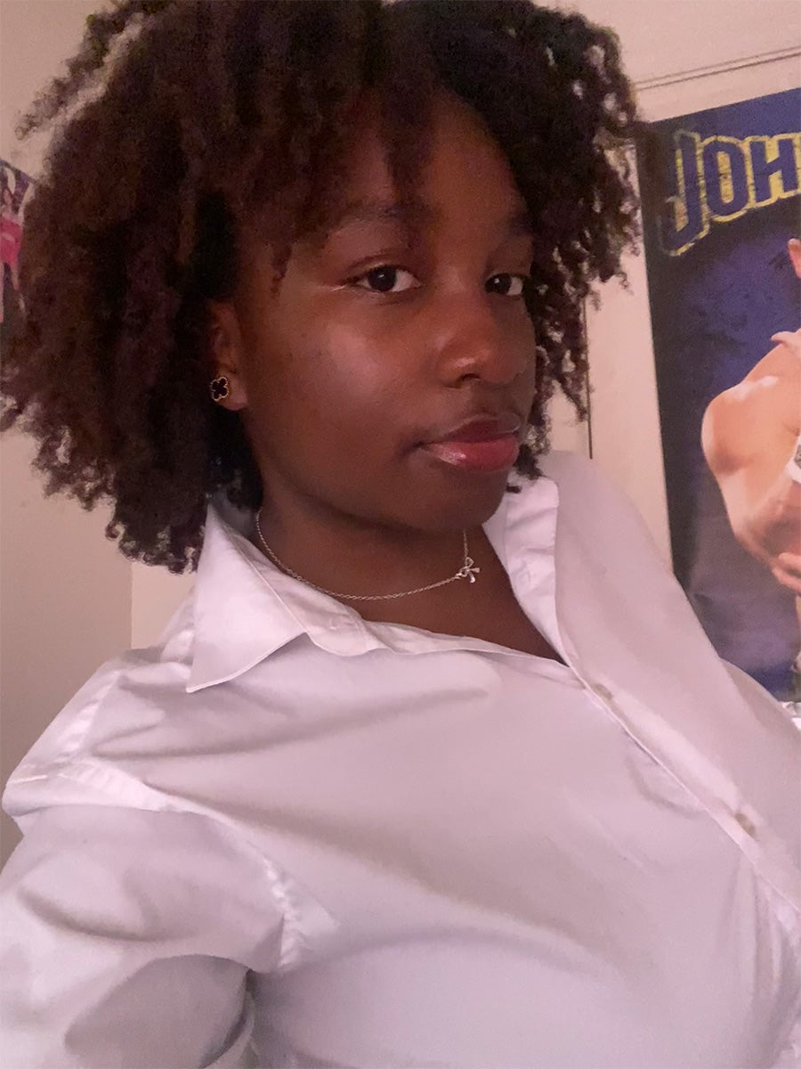 Teyana Sackey's headshot features a woman posing in a white collar shirt