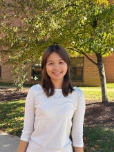 Headshot of a student wearing a white long sleeve shirt