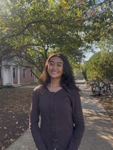 Headshot of student wearing a dark long sleeve shirt. 