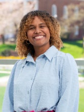 Headshot of Daniela Gava Duarte wearing a blue button down shirt.