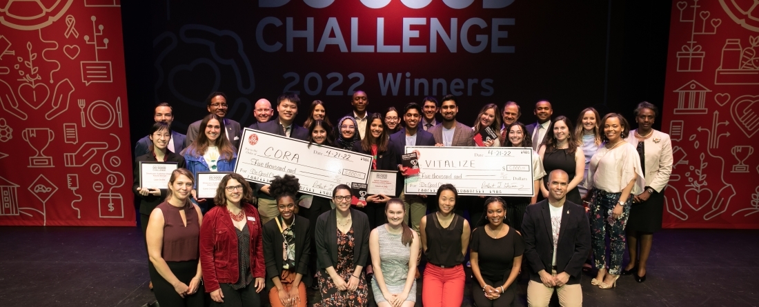 2022 Do Good Challenge finalists pose on stage following the event