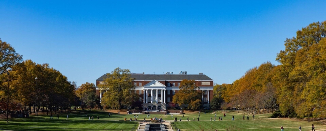 McKeldin Mall with a bright grassy field, and McKeldin library in the background. 